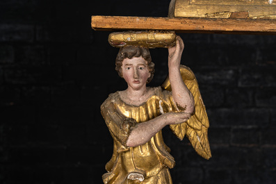 A polychromed and gilt wooden stand supported by two angels, 18th C.