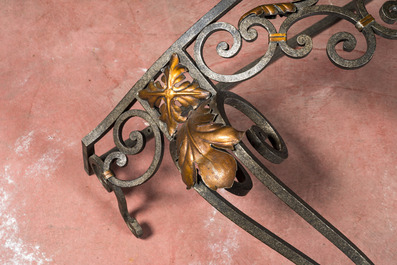 A wrought iron console with marble top, 20th C.