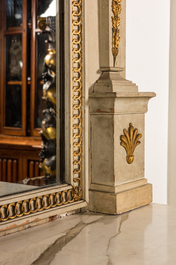 An impressive French Empire-style gray-patinated and gilt wooden mirror console with marble top, 19th C