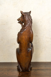 Two oak sculptures of mythical creatures with a shield, 19th C.