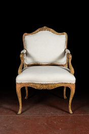 A French patinated wooden Louis XV armchair, 18th C.