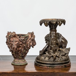 A faux bronze pottery group of a lion killing a camel and a patinated plaster jardini&egrave;re with lion's heads, 19th C.