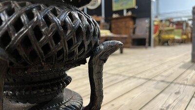 An Anglo-Indian colonial carved wooden plant stand with cobras and floral design, ca. 1900