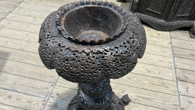 An Anglo-Indian colonial carved wooden plant stand with cobras and floral design, ca. 1900