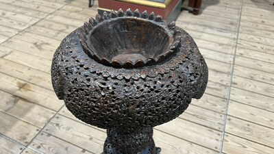 An Anglo-Indian colonial carved wooden plant stand with cobras and floral design, ca. 1900