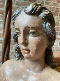A polychromed stone figure of Saint Sebastian, 17th C.