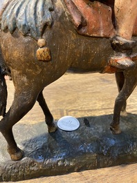 Een Vlaamse polychrome eikenhouten figuur van Sint-Maarten te paard, wellicht Antwerpen, 16e eeuw