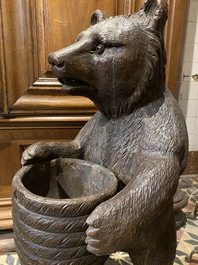 A 'Black Forest' wooden bear holding a beehive, Switzerland, 19th C.