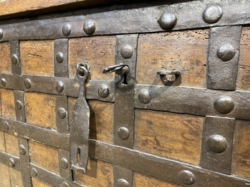 A wrought iron-mounted wooden coffer, 17th C.