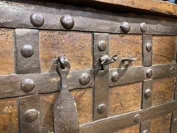 A wrought iron-mounted wooden coffer, 17th C.