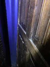 A Flemish oak three-door cupboard with carved panels, 16th C.