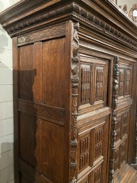 A rare German carved oak sculptural cupboard on diagonal supports with recumbent lions, Westphalia, 16th C.