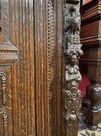 A rare German carved oak sculptural cupboard on diagonal supports with recumbent lions, Westphalia, 16th C.