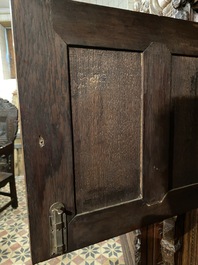 A rare German carved oak sculptural cupboard on diagonal supports with recumbent lions, Westphalia, 16th C.