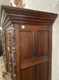 A rare German carved oak sculptural cupboard on diagonal supports with recumbent lions, Westphalia, 16th C.