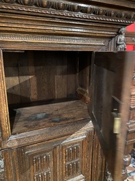 A rare German carved oak sculptural cupboard on diagonal supports with recumbent lions, Westphalia, 16th C.