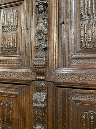 A rare German carved oak sculptural cupboard on diagonal supports with recumbent lions, Westphalia, 16th C.