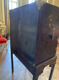 An English lacquered and painted chinoiserie cabinet on stand, 19th C.