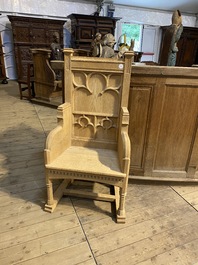 A French Gothic Revival white oak wooden armchair, 20th C.