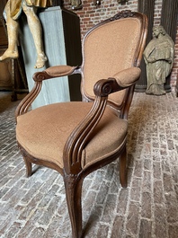 A French wooden armchair with curved back, 18th C.