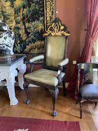 An impressive English partly gilt wooden masonic throne chair with leather upholstery, 19th C.