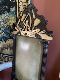 An impressive English partly gilt wooden masonic throne chair with leather upholstery, 19th C.