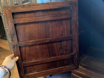 A Chinese hardwooden brass mounted two-door cabinet on foot, 20th C.