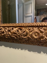 A finely carved gilt wooden mirror, probably Italy, 17/18th C.