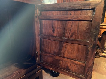 A Chinese hardwooden brass mounted two-door cabinet on foot, 20th C.