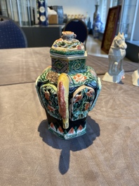 A Chinese verte biscuit reticulated teapot and cover, Kangxi