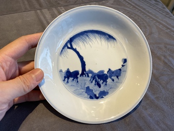 A Chinese blue and white 'Horses of Mu Wang' plate, Kangxi mark and of the period