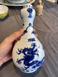 A Chinese blue and white 'dragons' bottle vase, Jiajing mark, 19/20th C.