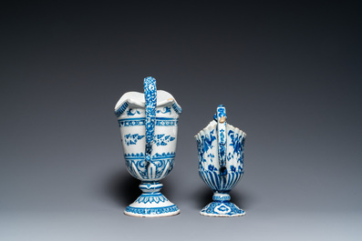 Two blue and white French faience helmet-shaped jugs, Rouen and Nevers, 18th C.