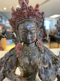 A Sino-Tibetan gilt-lacquered bronze Vasudhara, 17th C.