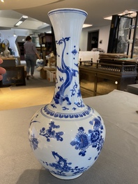 A Chinese blue and white bottle vase with a dragon on the neck, Transitional period