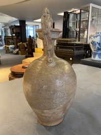 A Chinese straw-glazed stoneware amphora with dragon handles, Tang