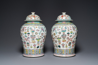 A pair of Chinese famille rose 'antiquities' vases and covers, 19th C.