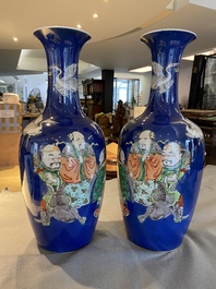 A pair of Chinese famille verte powder-blue-ground vases, 19th C.