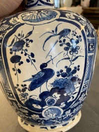 A pair of Dutch Delft blue and white chinoiserie bottle vases, 18th C.