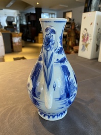 A Chinese blue and white ewer with figures in a landscape, Transitional period