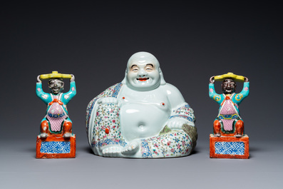 A Chinese famille rose Buddha and a pair of candlesticks, 19/20th C.