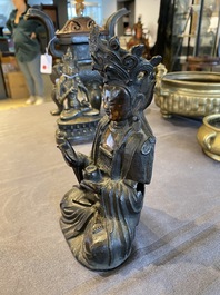 A Sino-Tibetan gilt-lacquered bronze Medicine Buddha or Bhaishajyaguru, Ming