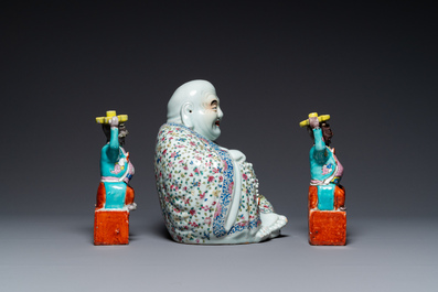 A Chinese famille rose Buddha and a pair of candlesticks, 19/20th C.