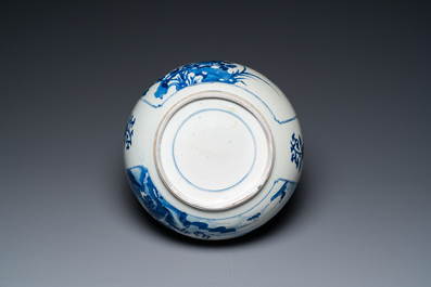 A Chinese blue and white bowl with figures in a landscape, Kangxi