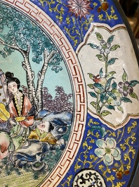 A Chinese Canton enamel dish with a European tea scene and one with ladies and boys, 18/19th C.