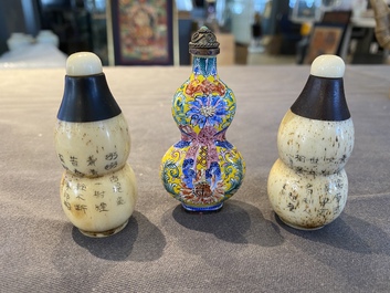 A Chinese Canton enamel snuff bottle and a pair of bone snuff bottles, 19th C.