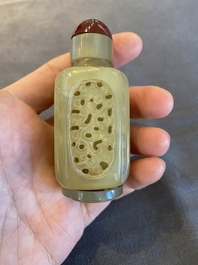 A Chinese reticulated and movable celadon jade snuff bottle, Qing