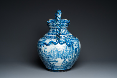 A large Dutch Delft blue and white vase depicting a country house, 1st quarter 18th C.