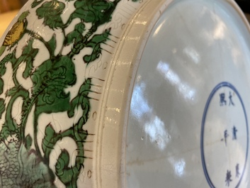 A rare Chinese biscuit-enamelled sancai dish with anhua dragon design, Kangxi mark and of the period