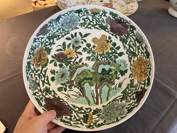 A rare Chinese biscuit-enamelled sancai dish with anhua dragon design, Kangxi mark and of the period